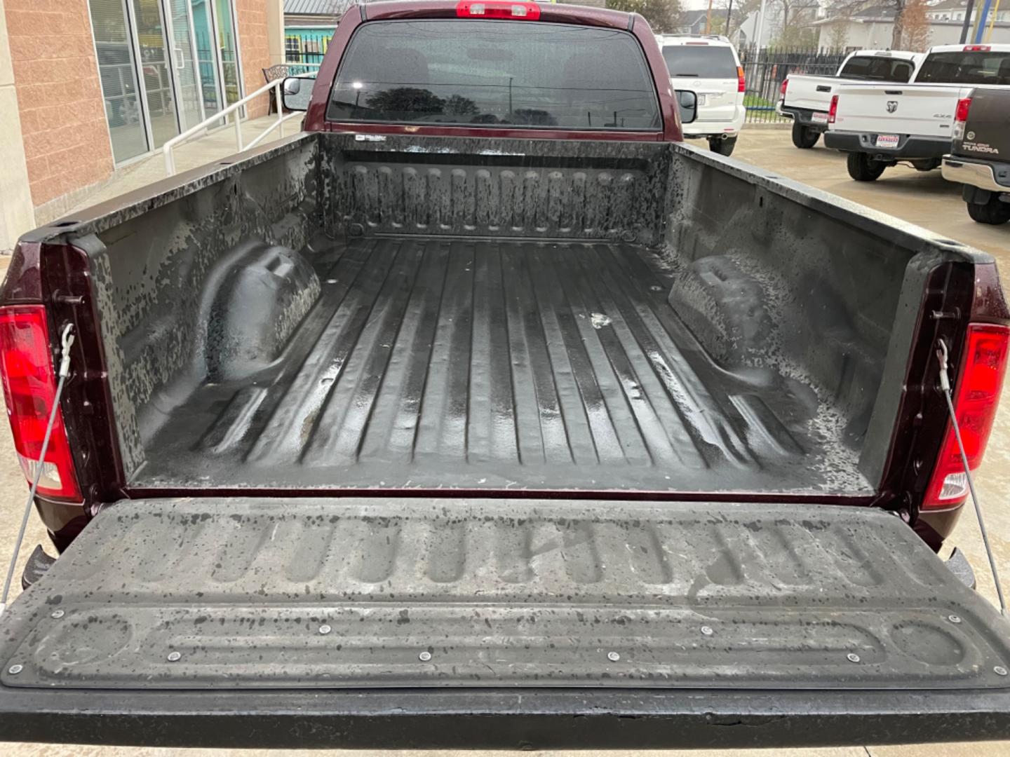 2004 Maroon /Black Dodge Ram 2500 Laramie 2WD (3D7KA26C44G) with an 5.9L L6 OHV 24V TURBO DIESEL engine, Automatic transmission, located at 1501 West 15th St., Houston, 77008, (713) 869-2925, 29.797941, -95.411789 - Photo#11